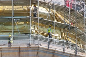 Workers standing in kwikstage scaffolding